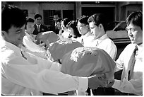 Gifts are exchanged in front of the bride's home. Ho Chi Minh City, Vietnam (black and white)
