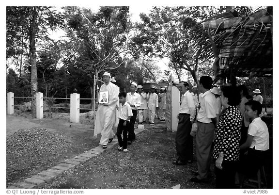 Procession at a countryside funeral. Ben Tre, Vietnam (black and white)