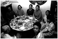 Family meal. Ho Chi Minh City, Vietnam (black and white)