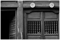 Detail of a wooden facade, Hoi An. Hoi An, Vietnam (black and white)