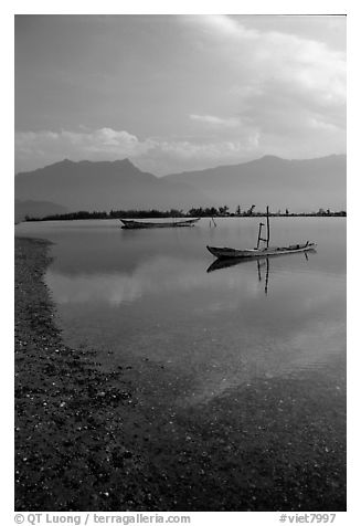 Small boats in lagoon. Vietnam (black and white)