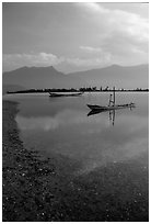 Small boats in lagoon. Vietnam (black and white)