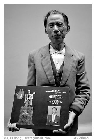 Former militia member with certificate of heroism, Hanoi. Vietnam (black and white)