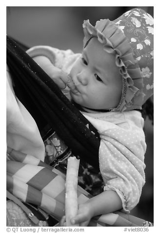 Baby enjoying sugar cane, the natural lollypop,  Bac Ha. Vietnam (black and white)