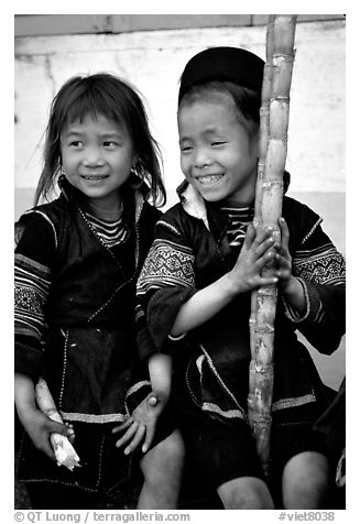Black Hmong girls, with their daily fix of sugar cane, Sapa. Vietnam (black and white)