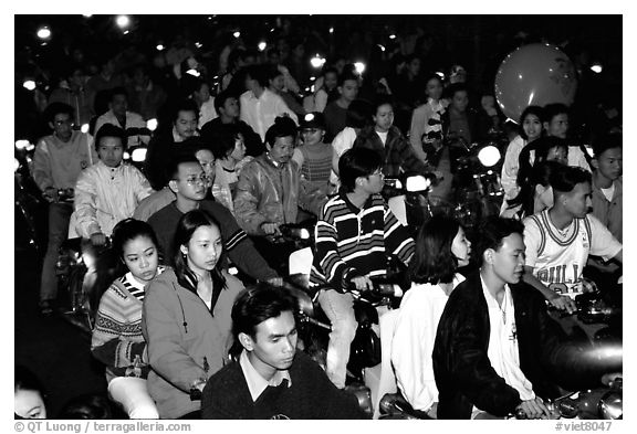 Traffic: motorcycles densely packed on a holiday night. Ho Chi Minh City, Vietnam