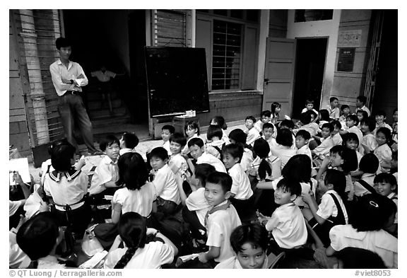 Children at school. Like everywhere else in Asia, uniforms are the norm. Ho Chi Minh City, Vietnam (black and white)