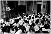 Children at school. Like everywhere else in Asia, uniforms are the norm. Ho Chi Minh City, Vietnam ( black and white)