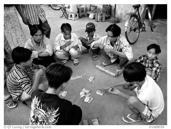 Children playing cards. Ho Chi Minh City, Vietnam (black and white)
