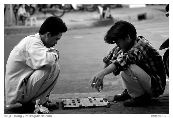 Chinese Chess game. Vietnamese people can sit on their heels for hours. Ho Chi Minh City, Vietnam