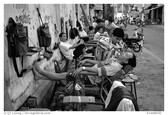 Outdoor hair dressing salon. Ho Chi Minh City, Vietnam (black and white)