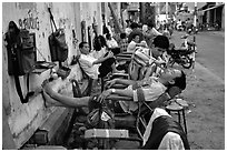 Outdoor hair dressing salon. Ho Chi Minh City, Vietnam ( black and white)