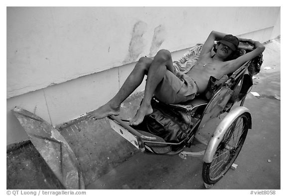 Cyclo driver taking an afternoon nap. Ho Chi Minh City, Vietnam