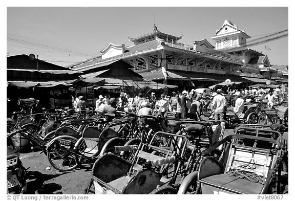 Cyclos wait outside the Bin Tay market in Cholon, district 6. Cholon, Ho Chi Minh City, Vietnam