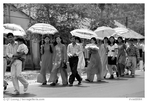 Traditional wedding procession on a countryside road. Ben Tre, Vietnam (black and white)