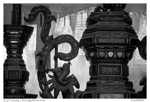 Red color is believed to be lucky. Urn and incense coils, Cho Lon. Cholon, District 5, Ho Chi Minh City, Vietnam (black and white)