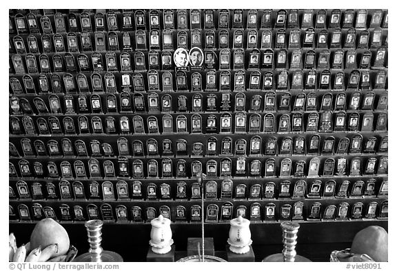 Pictures of the deceased for veneration on altar. Ho Chi Minh City, Vietnam (black and white)