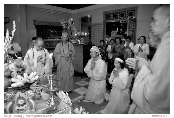 Buddhist funeral ceremony. Note that white is the color used for mourning. Ho Chi Minh City, Vietnam