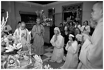 Buddhist funeral ceremony. White is color for mourning, Xa Loi pagoda, district 3. Ho Chi Minh City, Vietnam ( black and white)