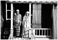 Muslem family outside stilt house in Cham minority village. Chau Doc, Vietnam ( black and white)