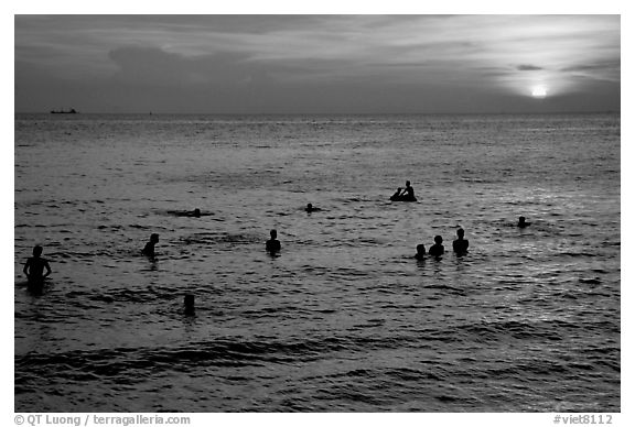 Soaking in the warm China sea at sunset. Vung Tau, Vietnam