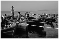 Children play on fishing boats. Vung Tau, Vietnam (black and white)