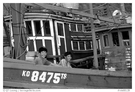 Fishermen on a commercial fishing boat. Ha Tien, Vietnam (black and white)