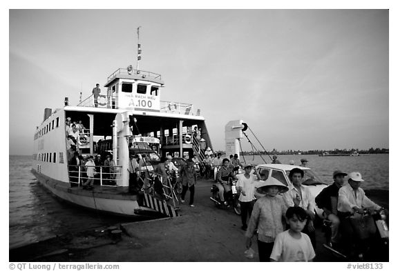 Disembarking from a ferry on one of the many arms of the Mekong. My Tho, Vietnam (black and white)