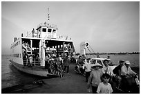 Disembarking from a ferry on one of the many arms of the Mekong. My Tho, Vietnam (black and white)