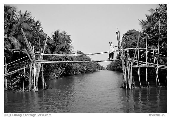 Bamboo bridge (called monkey bridge) near Phung Hiep. Can Tho, Vietnam (black and white)