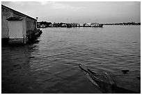 Floating houses. They double as fish reservoirs. Chau Doc, Vietnam (black and white)