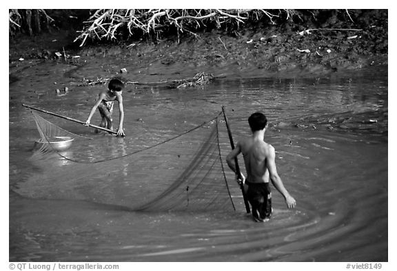 Fishing the river, near Long Xuyen. Mekong Delta, Vietnam (black and white)