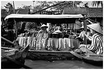 Garnments for sale on the Phong Dien floating market. Can Tho, Vietnam (black and white)