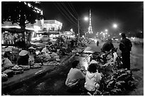 Night market and the local Eiffel tower. Da Lat, Vietnam (black and white)