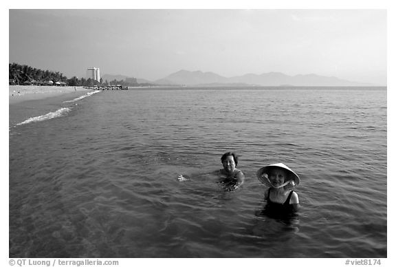 Early morning bath on a perfect beach Nha Trang. Vietnam (black and white)