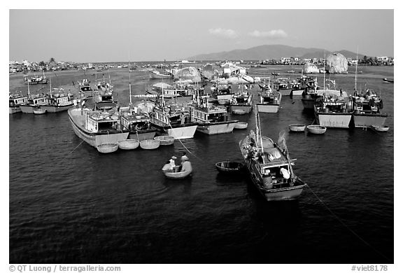 Colorfull fishing boats. Note the circular basket boats used to get to shore.  Nha Trang. Vietnam