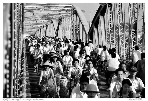 Rush hour on the Trang Tien bridge. The numbers of cars is insignificant compared to Ho Chi Minh city. Hue, Vietnam (black and white)