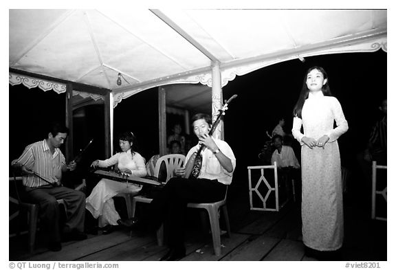 Traditional floating concert on the Perfume river. The city has remained Vietnam's artistic center. Hue, Vietnam