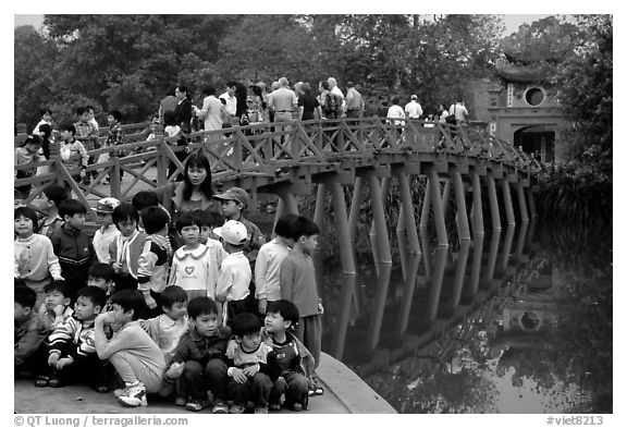 School children at The Huc bridge, Hoan Kiem lake. Hanoi, Vietnam