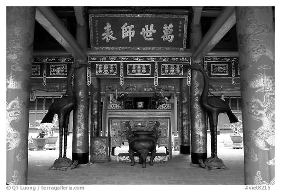 Red columns and altar with phoenix, Temple of the Literature. Hanoi, Vietnam