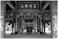 Red columns and altar with phoenix, Temple of the Literature. Hanoi, Vietnam (black and white)