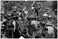 Colorful crowd at the sunday market, where people from the surrounding hamlets gather weekly to meet, shop and eat. Bac Ha, Vietnam (black and white)