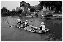 Villagers transport stones from the quary on Ken Ga canal. Ninh Binh,  Vietnam (black and white)