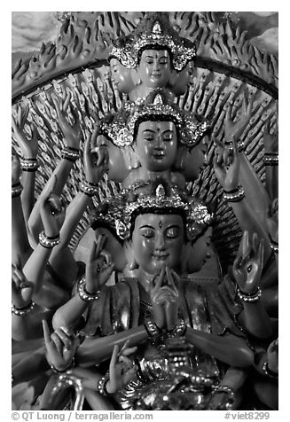 Detail of a buddhist sculpture with many heads. Ha Tien, Vietnam (black and white)