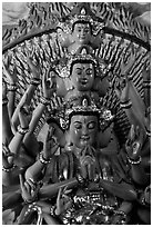 Detail of a buddhist sculpture with many heads. Ha Tien, Vietnam (black and white)