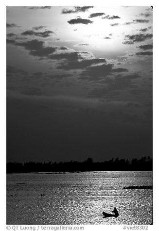 Small boat at sunrise. Chau Doc, Vietnam (black and white)