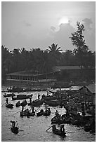 River activity at sunrise. Can Tho, Vietnam (black and white)