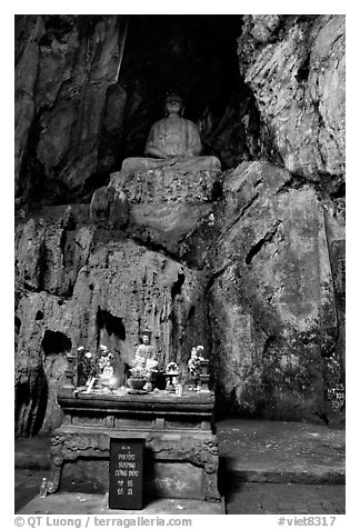 Altar and Buddha statue in a troglodyte sanctuary of the Marble Mountains. Da Nang, Vietnam