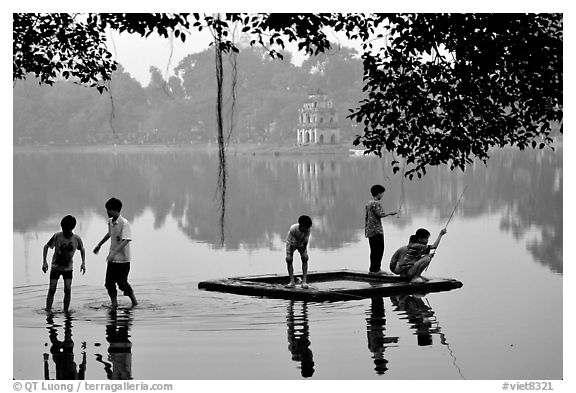 Children playing,  Hoan Kiem Lake. Hanoi, Vietnam (black and white)