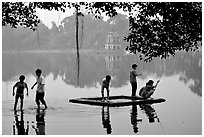 Children playing,  Hoan Kiem Lake. Hanoi, Vietnam (black and white)